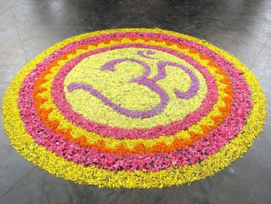 om rangoli designs with flowers