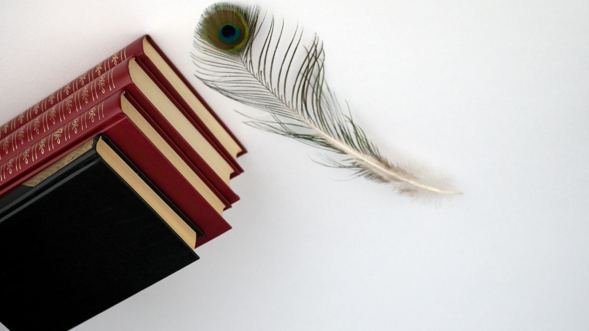 peacock feather in book