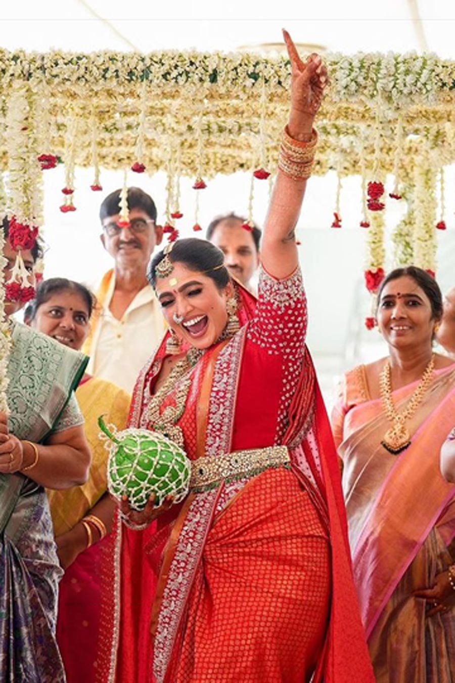 why do indian brides carry a coconut