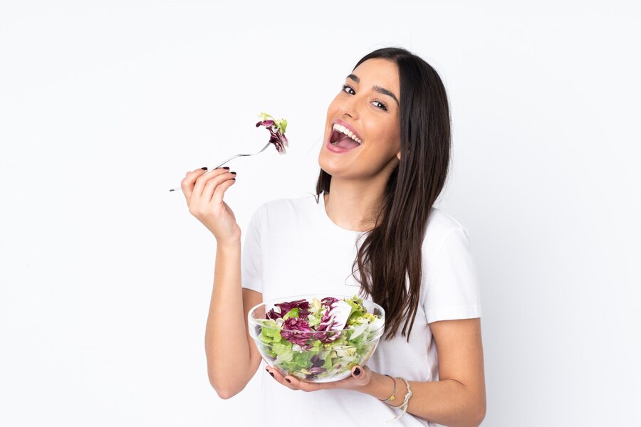 young woman with salad white  