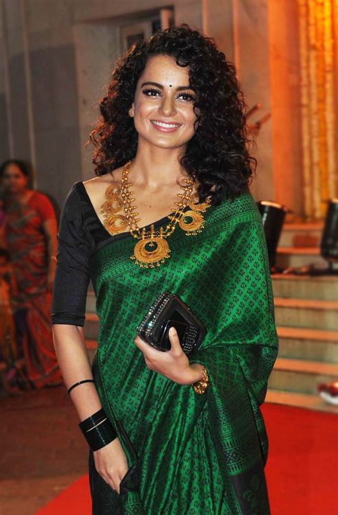 gold temple contrast jewellery with green saree