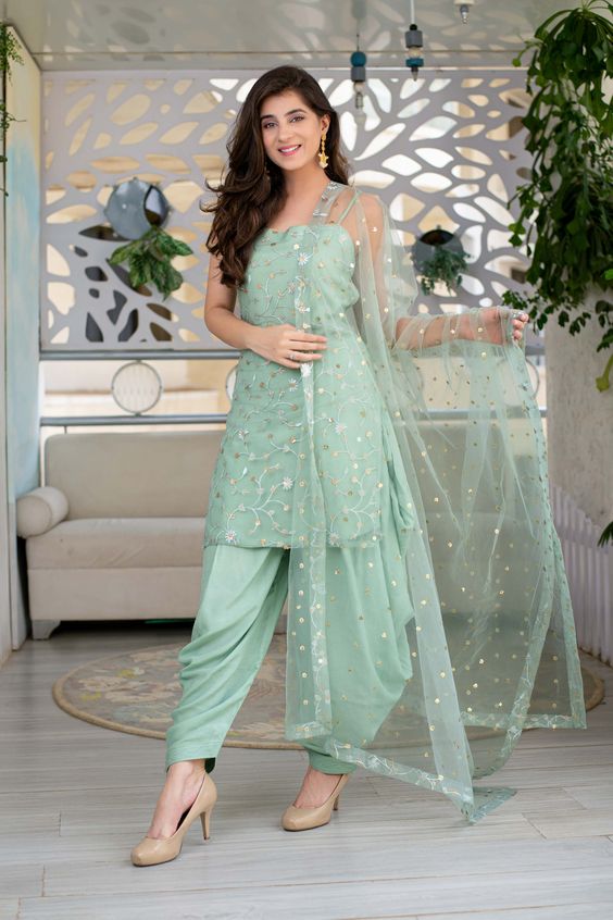 punjabi green suit for teej 