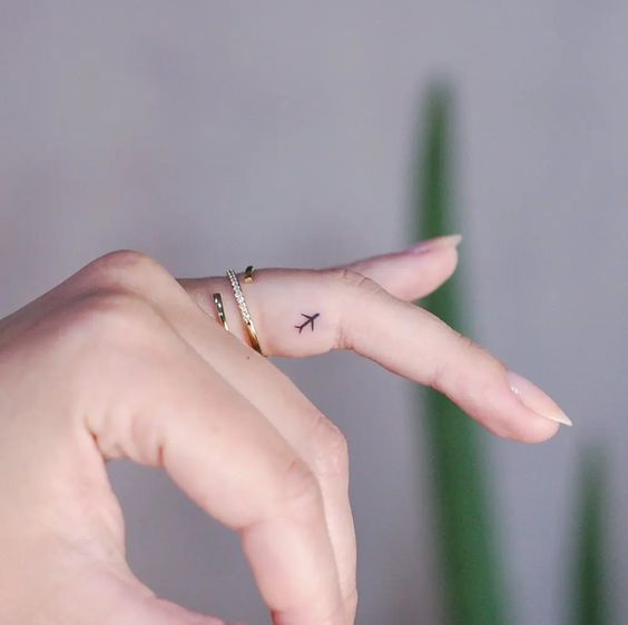finger tattoo travel