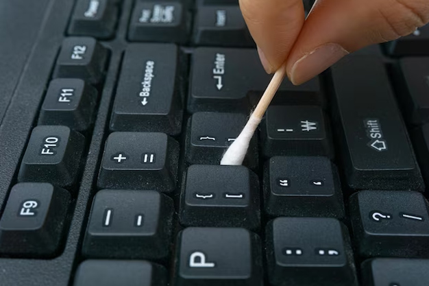how to clean laptop keyboard under keys
