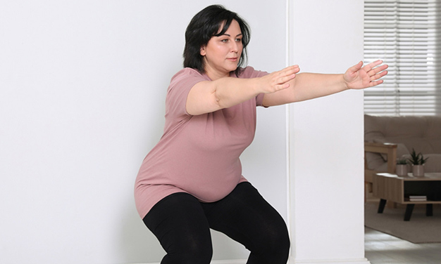 wall squat for body fat