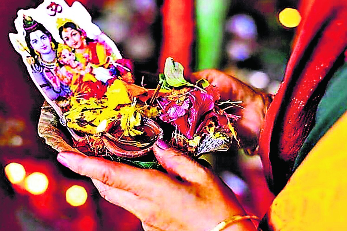 lighting flour diya with mustard oil on hartalika teej 