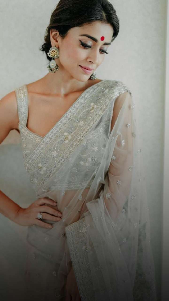 Photos] Shriya Saran stuns in peach heavy embroidered saree with deep neck  blouse design