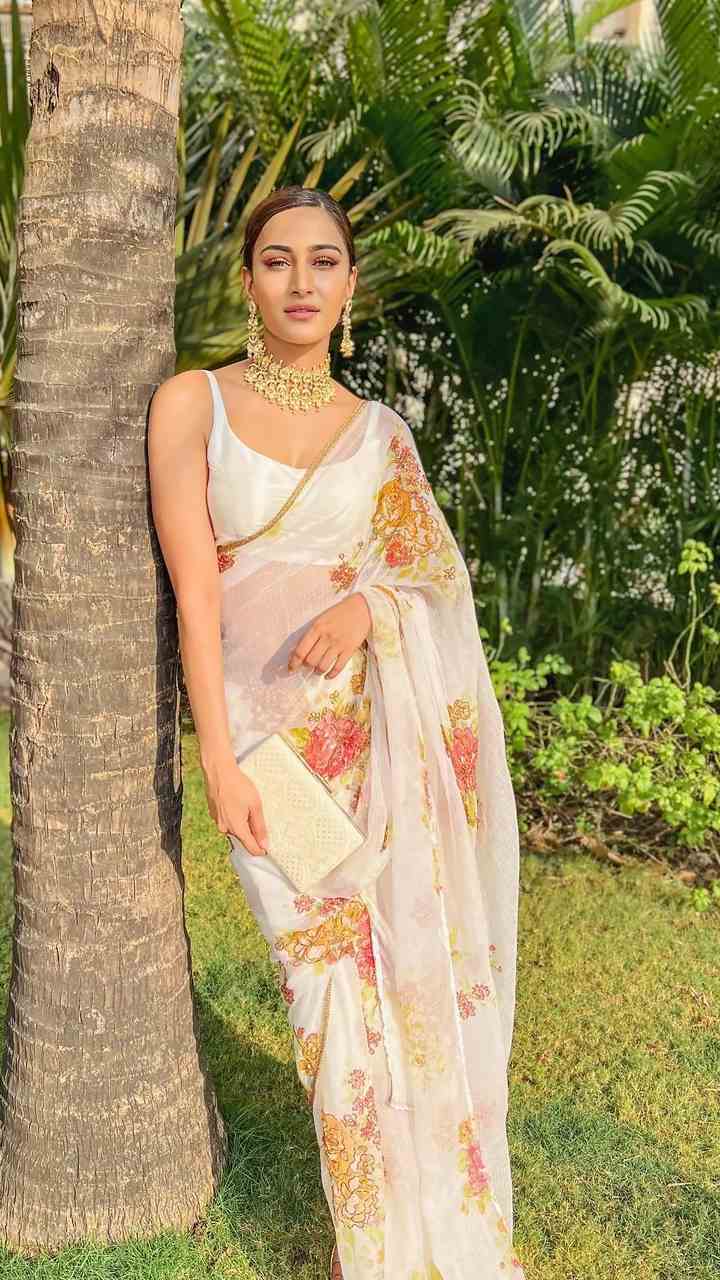 Erica Fernandes in Kalki plum saree in frill hem and pallo. KALKI Fashion  India
